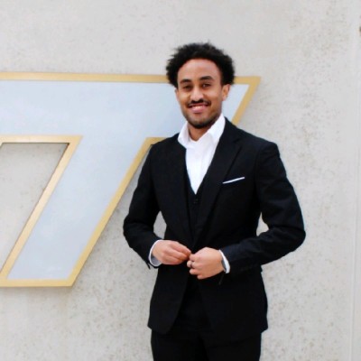 Kidus in a black suit